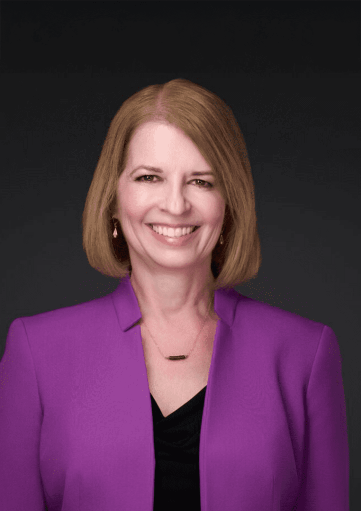 Smiling woman with blonde hair in purple blazer